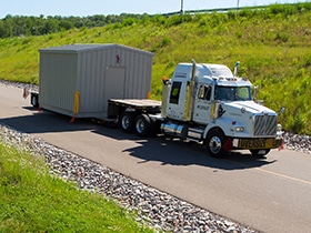 enclosure on flatbed truck