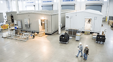 equipment enclosures in progress on factory floor